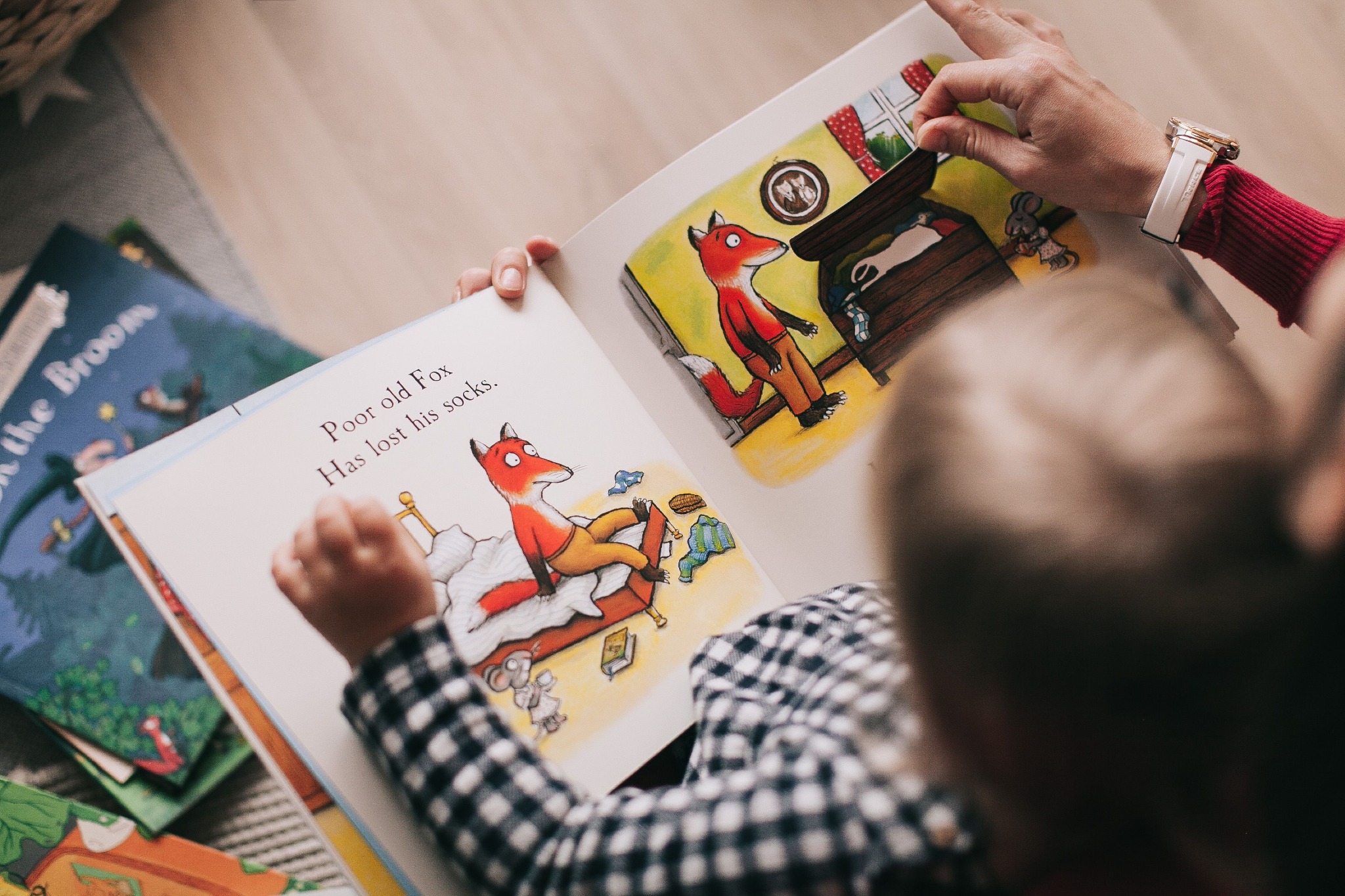 Adult and child working together with toys during a communication activity
